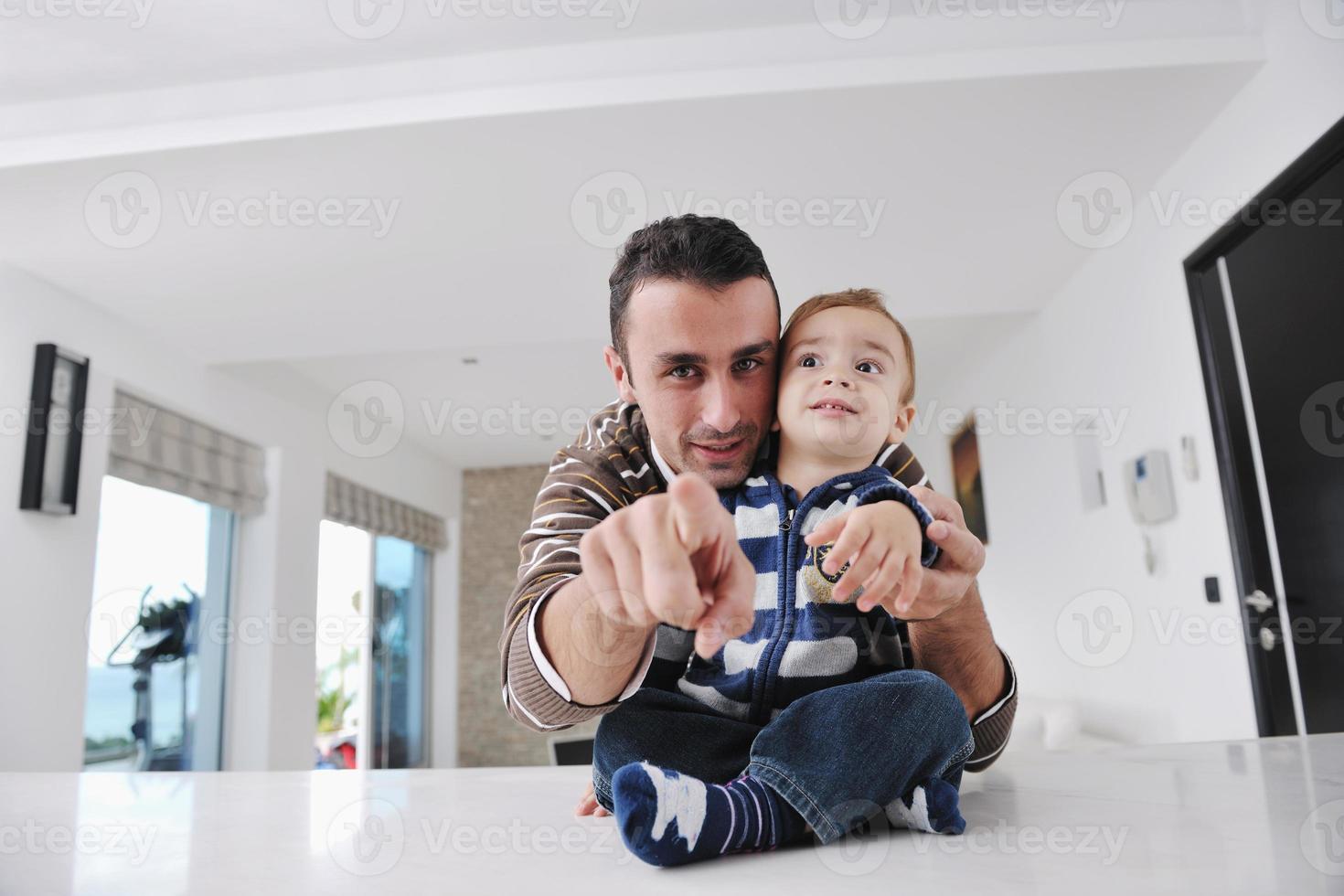happy young family have fun  at home photo