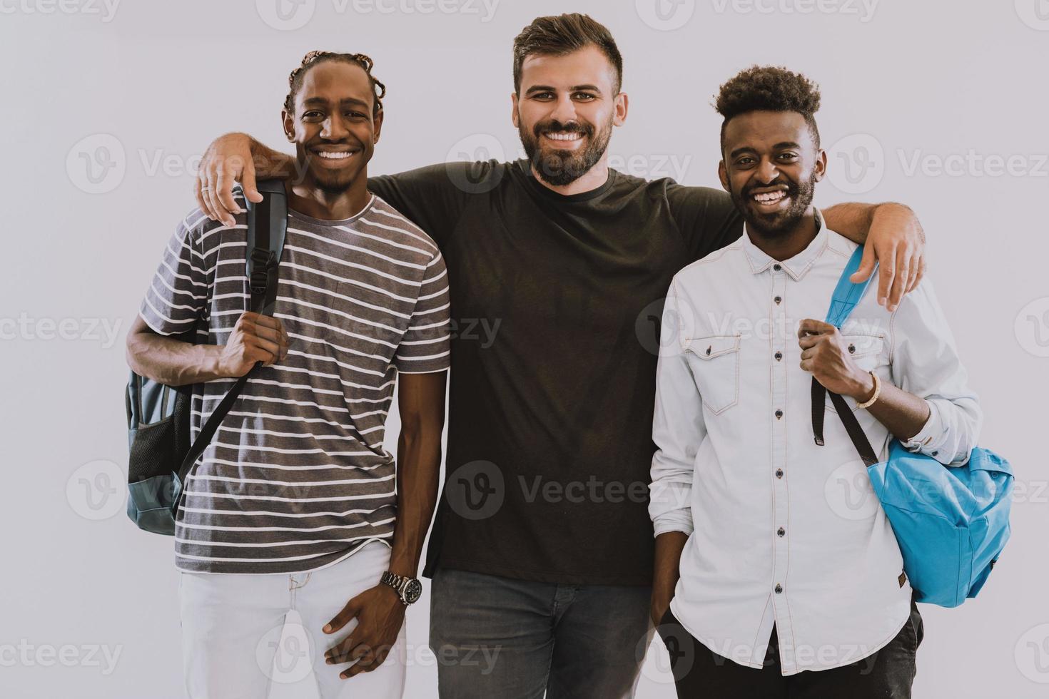 A photo of a group of happy students isolated on white background.
