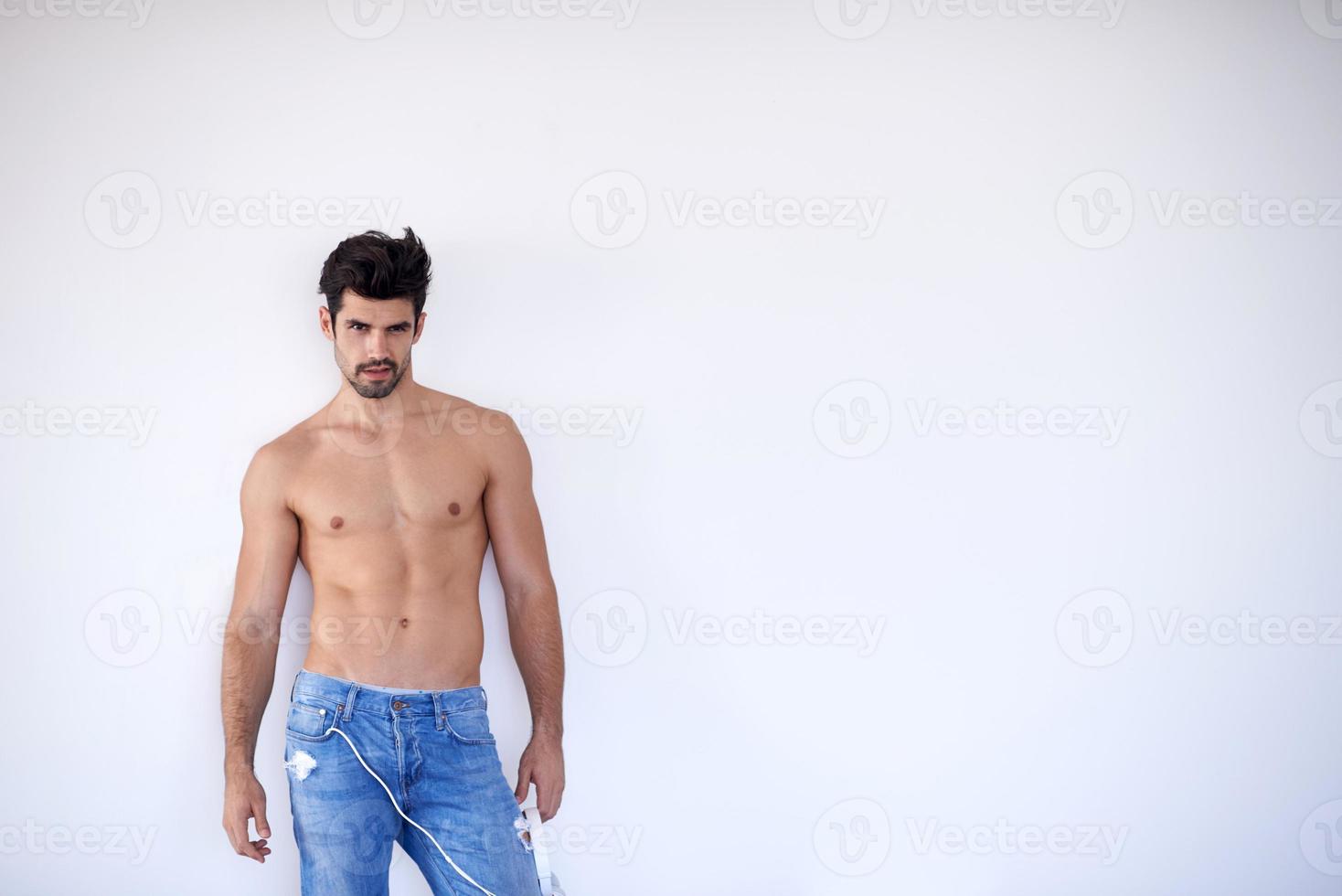 handsome young man listening music on headphones photo