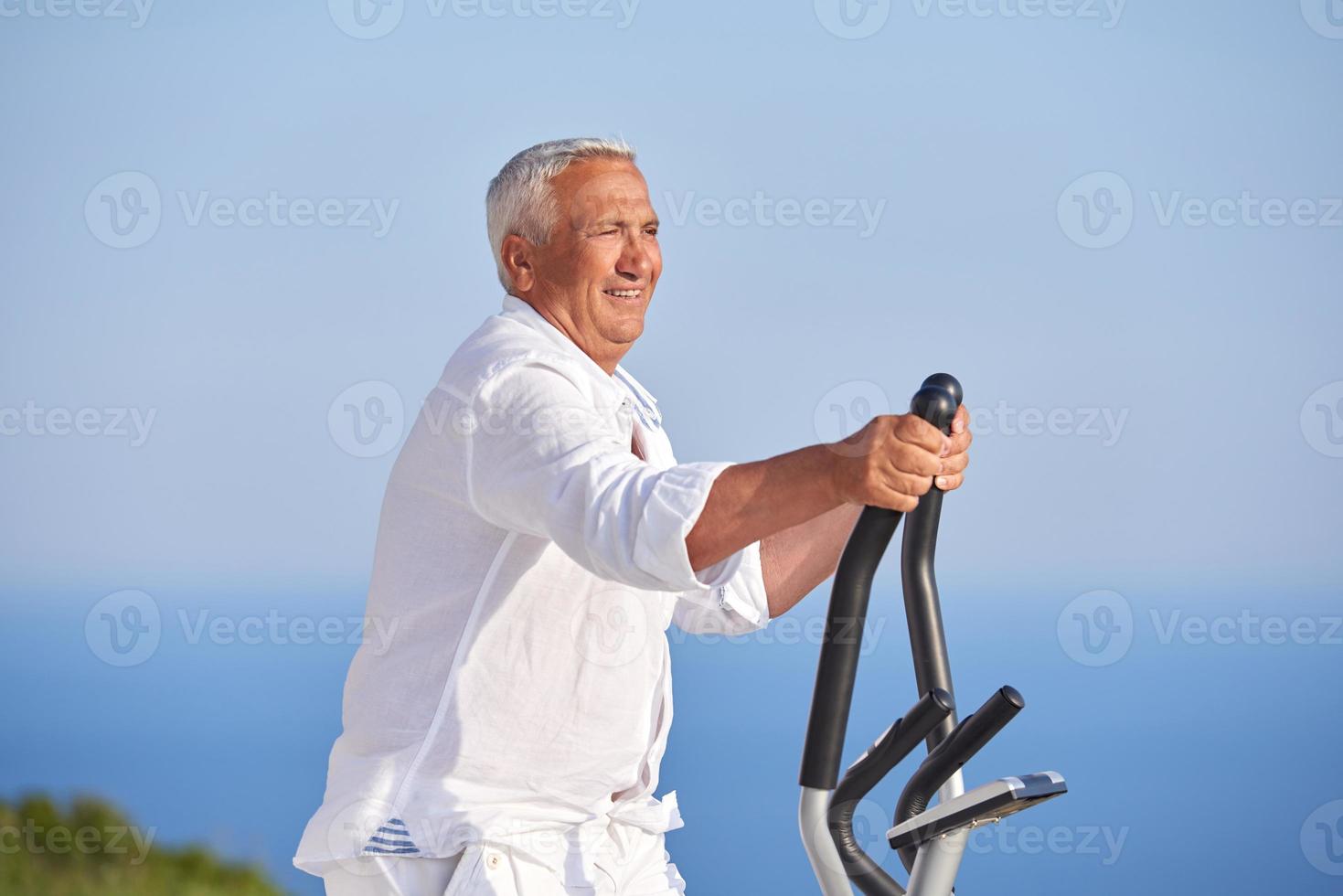 healthy senior man working out photo