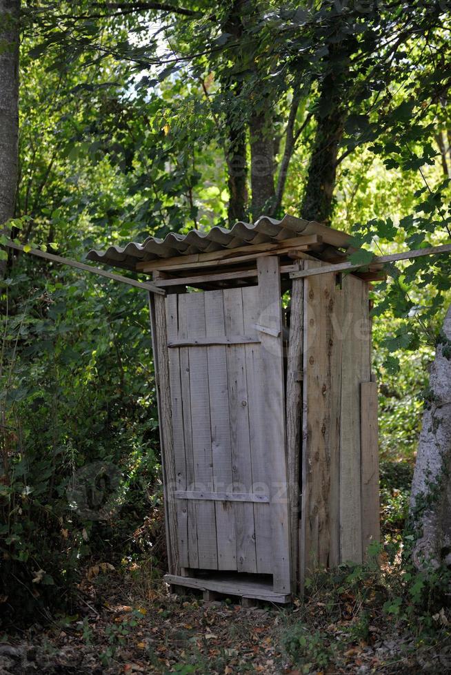 wooden retro outdoor toilet photo