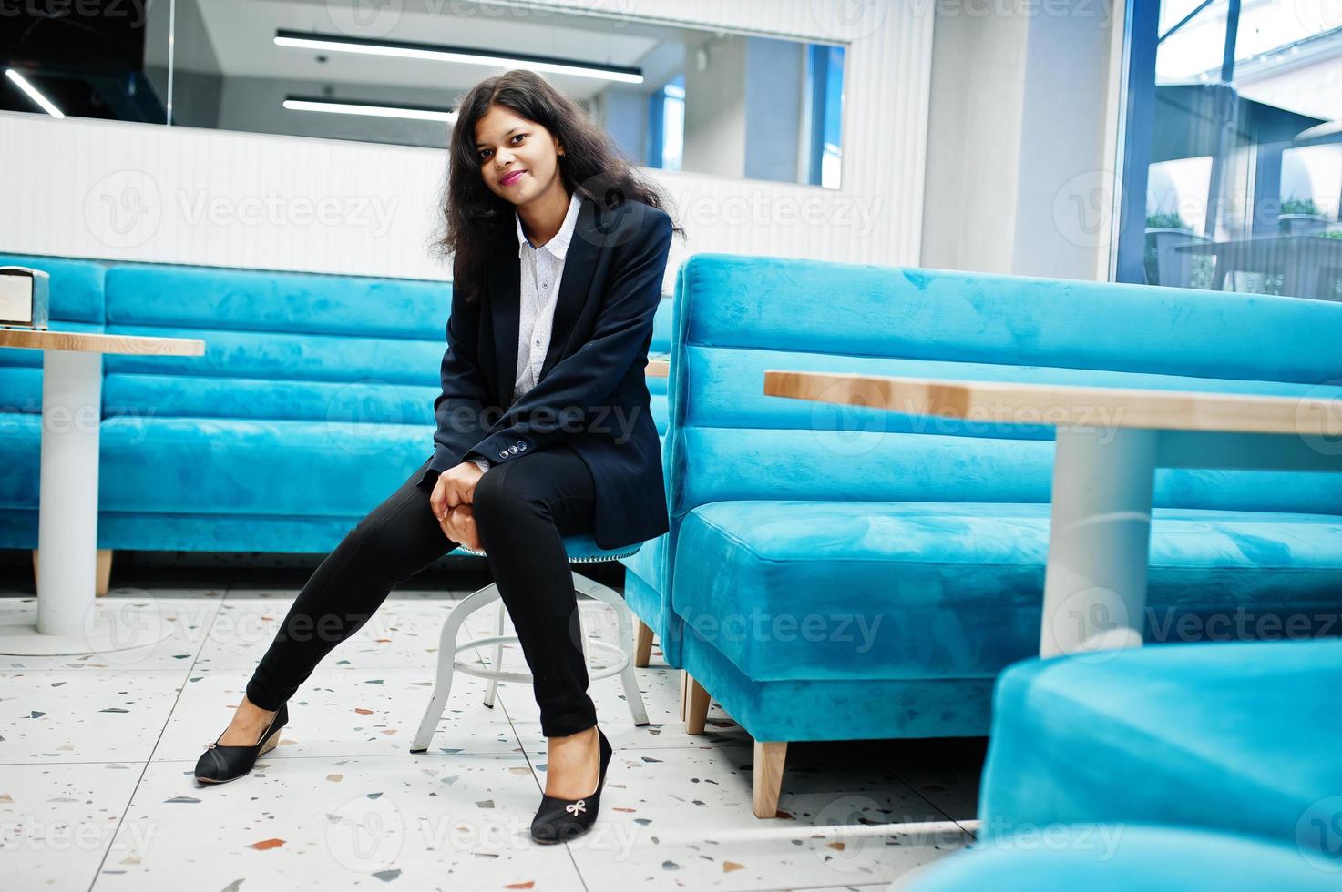 Gorgeous indian woman wear formal posing at cafe. photo