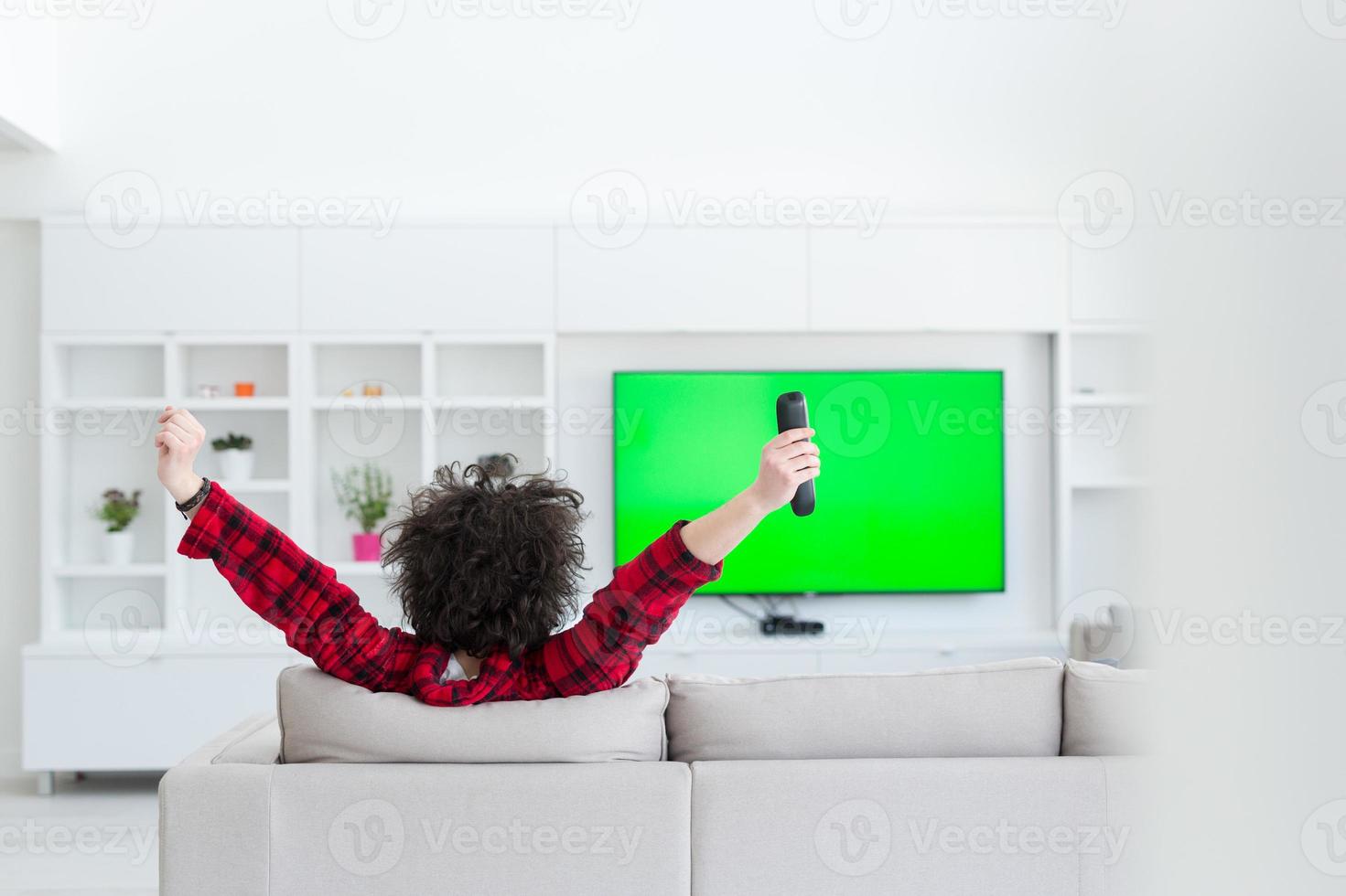 young man in bathrobe enjoying free time photo