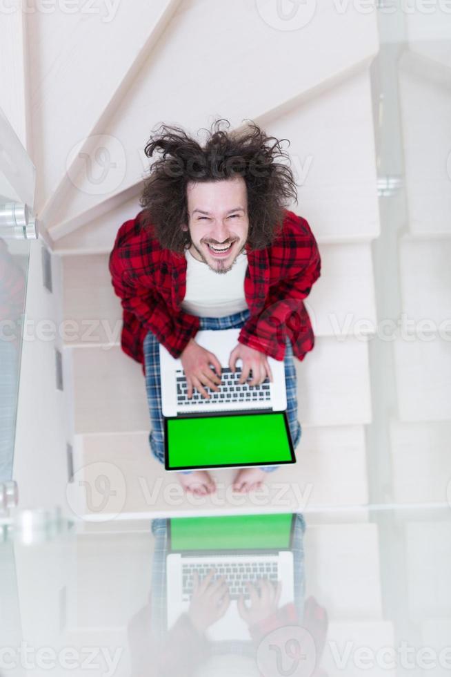 freelancer in bathrobe working from home photo