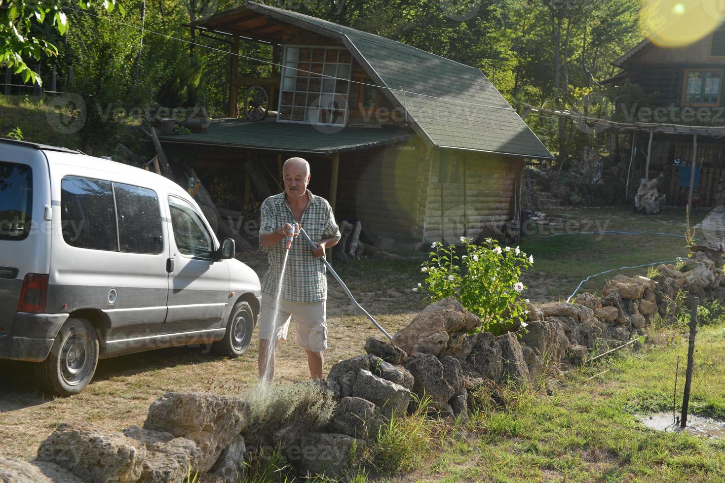 gardener watering the plants photo