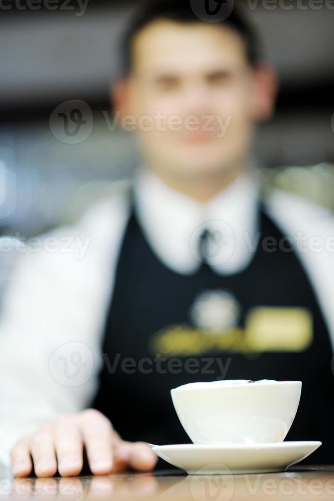 Barista prepares cappuccino photo