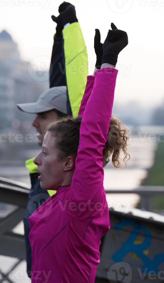 couple warming up before jogging photo