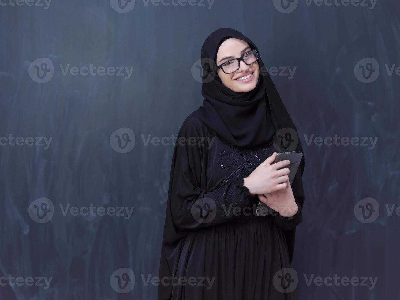 young muslim business woman using tablet computer photo