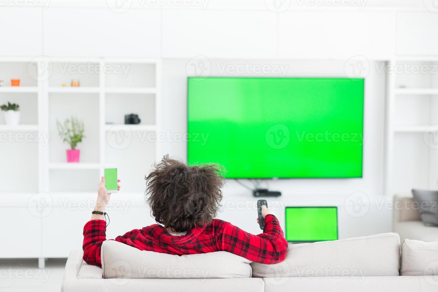 young man in bathrobe enjoying free time photo