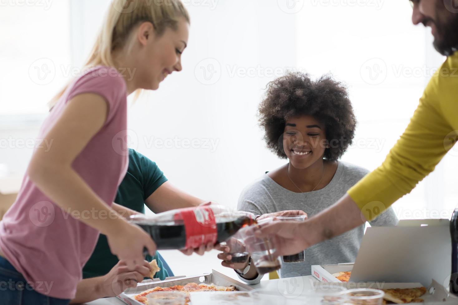 multiethnic group of young people have a lunch break photo