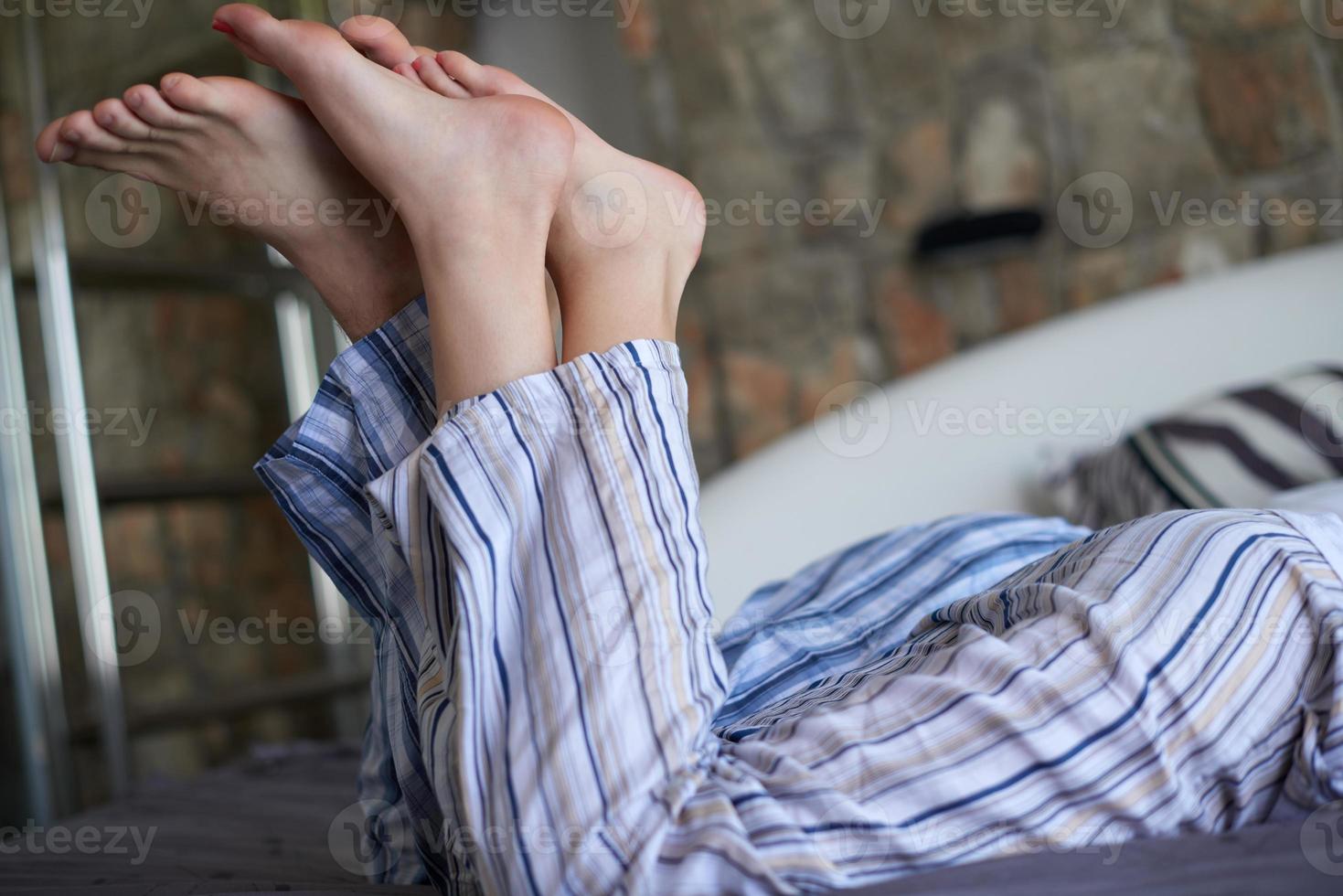 couple relax and have fun in bed photo