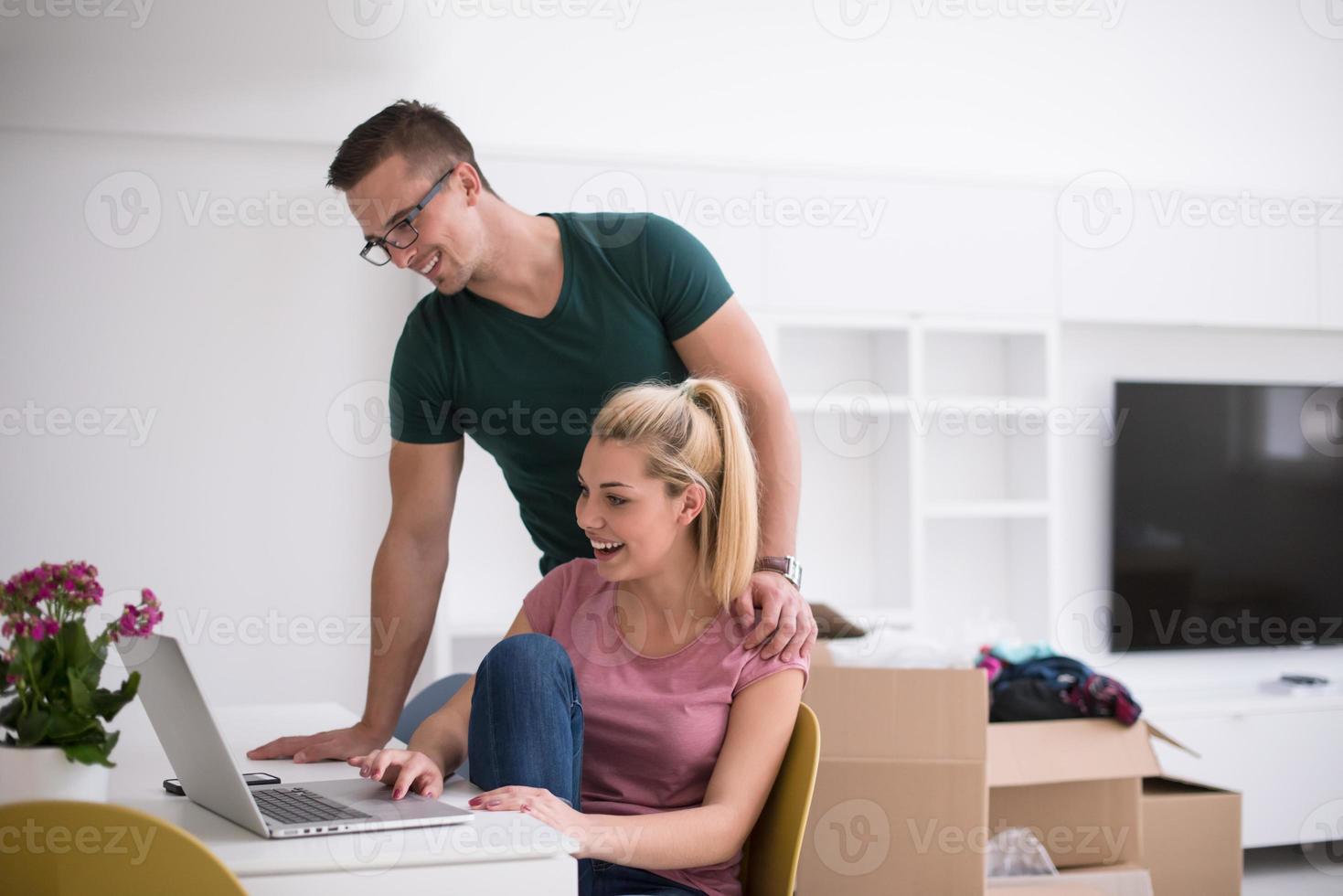 Young couple moving in a new home photo