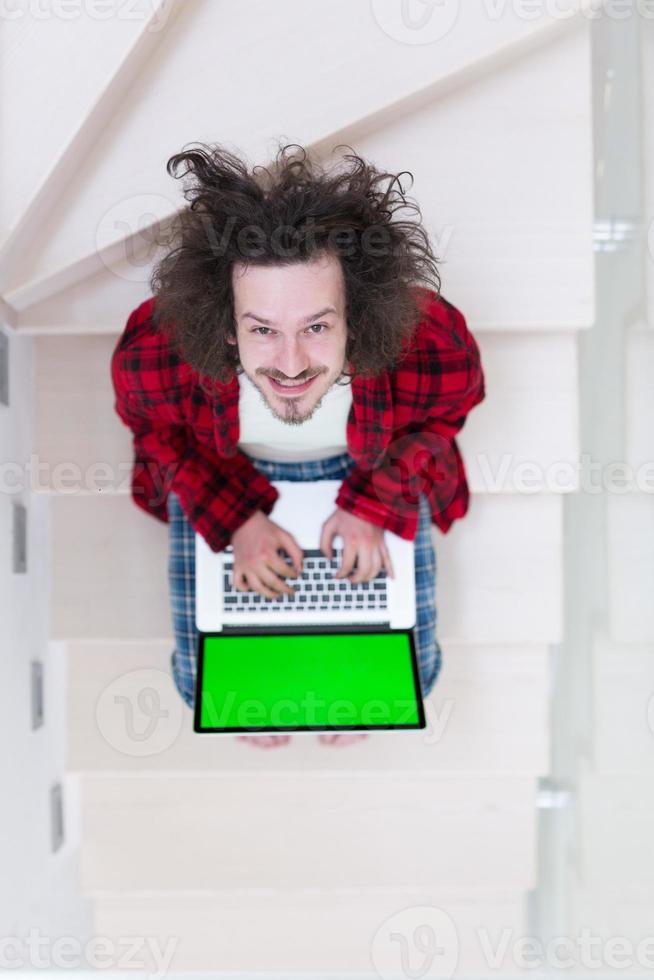 freelancer in bathrobe working from home photo