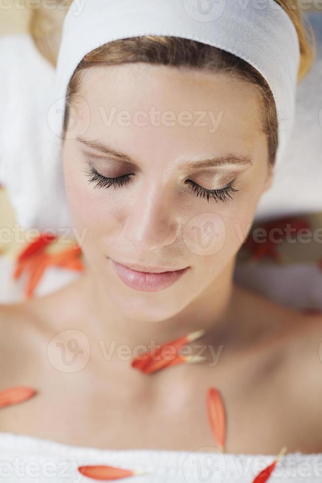 Beautiful young woman in spa photo