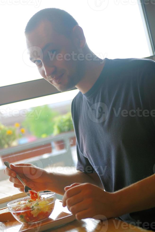 man eating healthy food it an restaurant photo