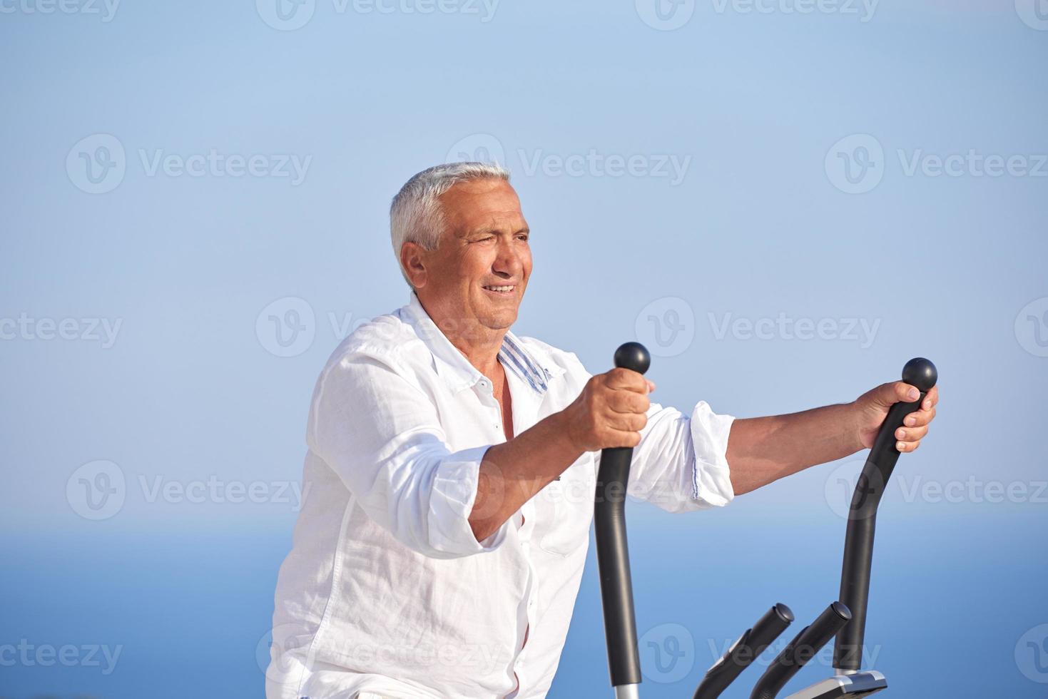 healthy senior man working out photo