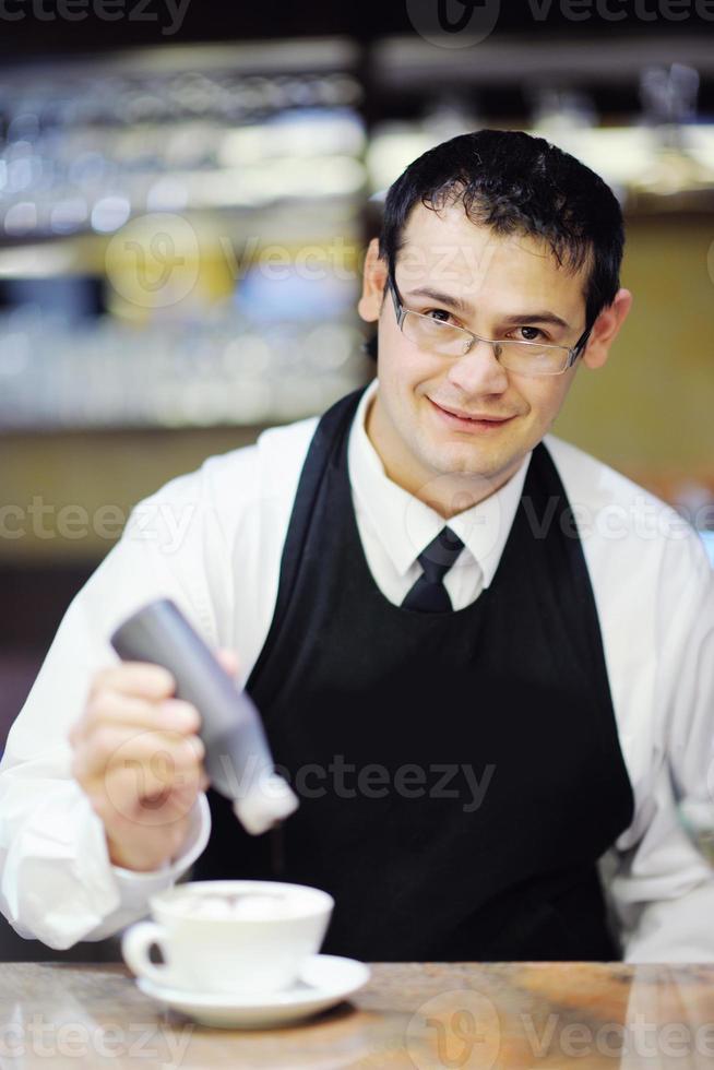 Barista prepares cappuccino photo