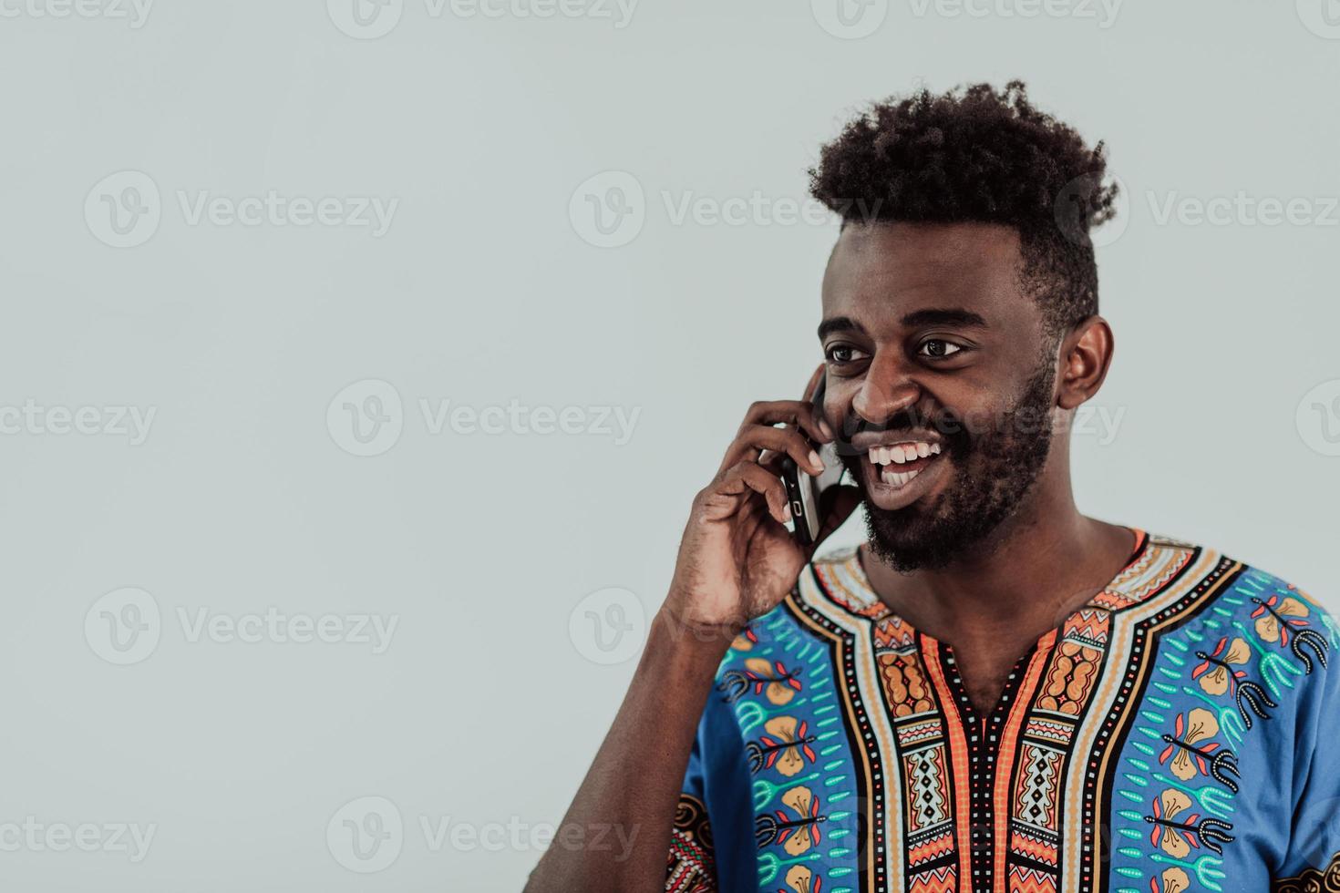 Native Sudan African male using smartphone isolated on white background. photo