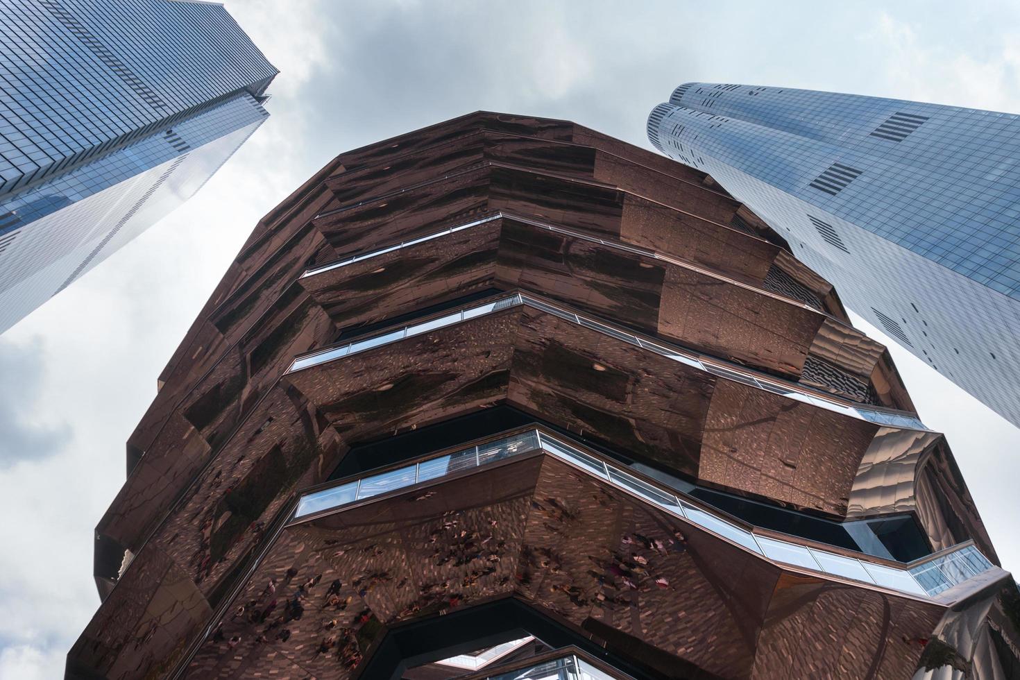 New York City, USA-August 7, 2019-View of the architectural structure called Vessel in Manhattan during a cloudy day photo