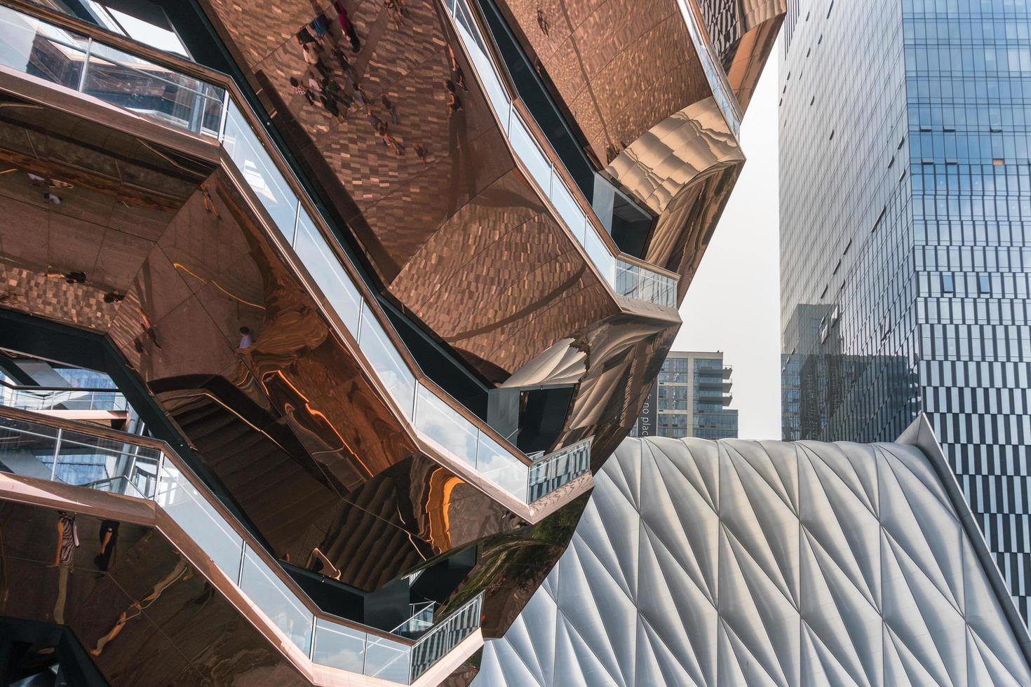 New York City, USA-August 7, 2019-View of the architectural structure called Vessel in Manhattan during a cloudy day photo