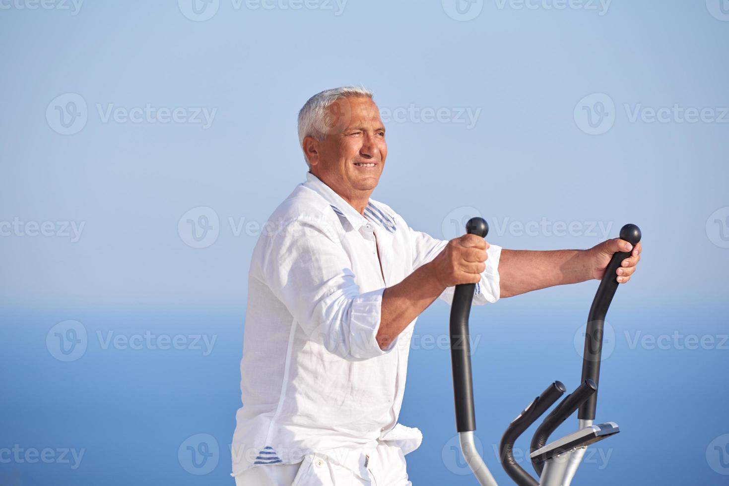 healthy senior man working out photo