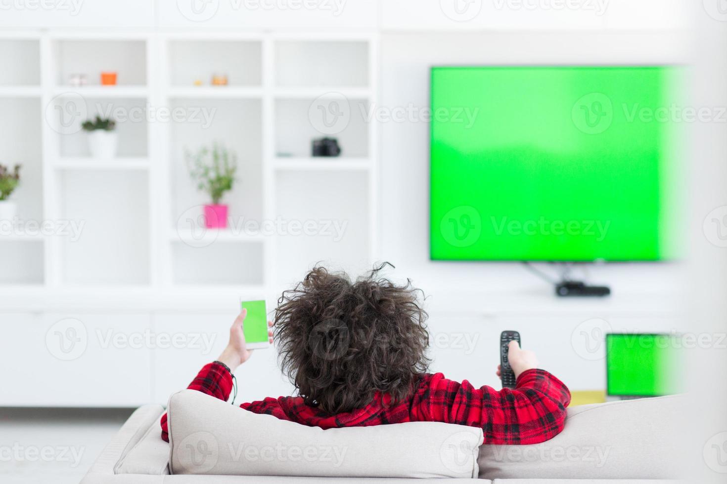 young man in bathrobe enjoying free time photo