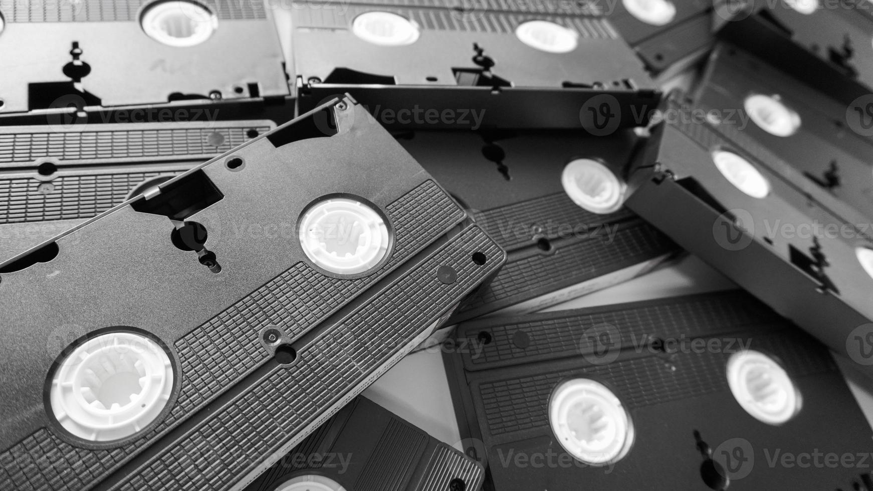 Messy stack of VHS tapes. Video Home System tape cassettes. photo