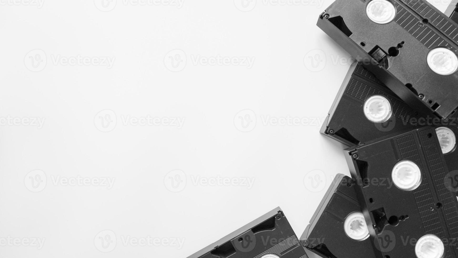 VHS tapes flat lay on white background with copy space photo