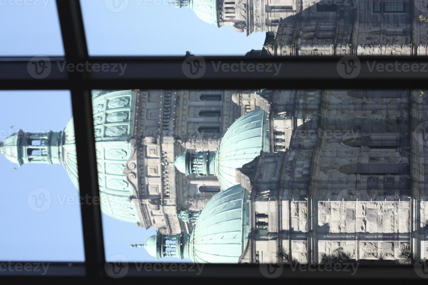 Gothic government building framed by a window. photo