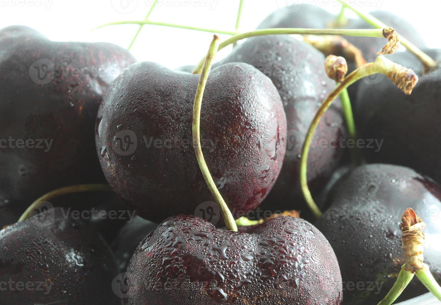 A close up shot of sweating cherries. photo