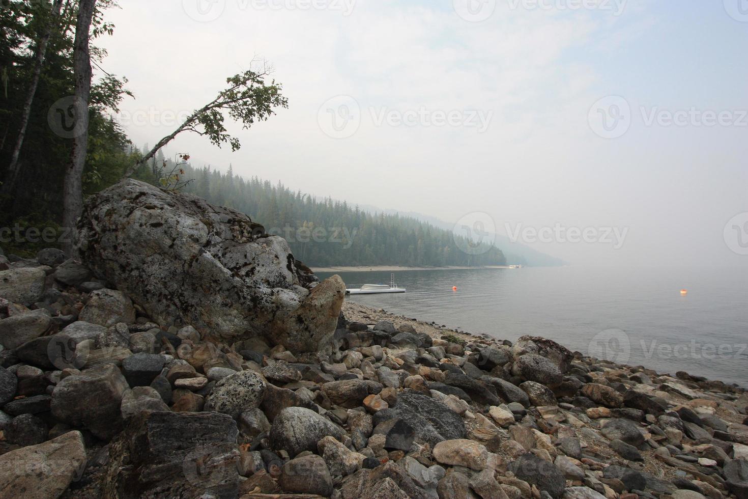 A rocky shore on a large lake. photo