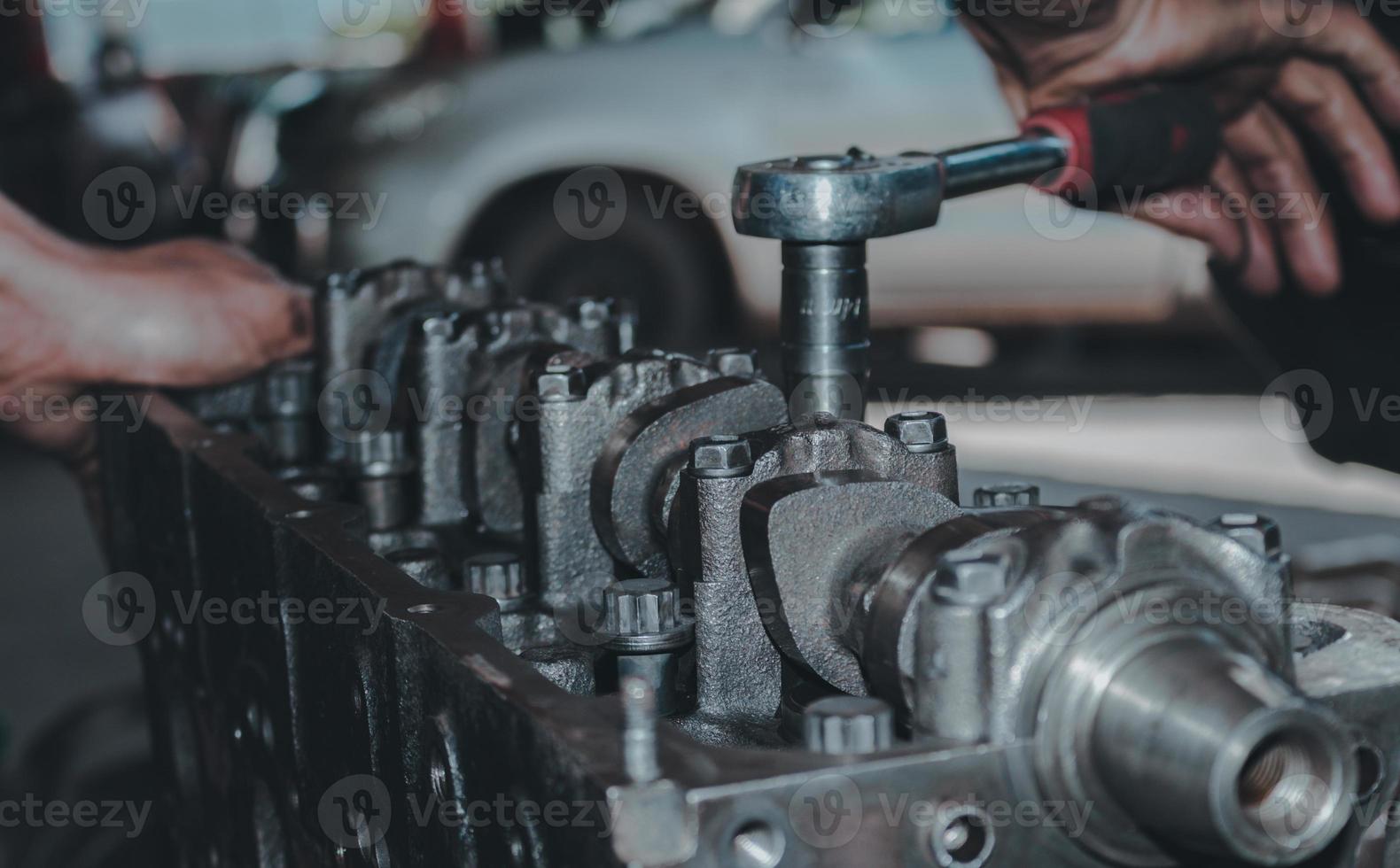 The mechanic is checking the engine. photo