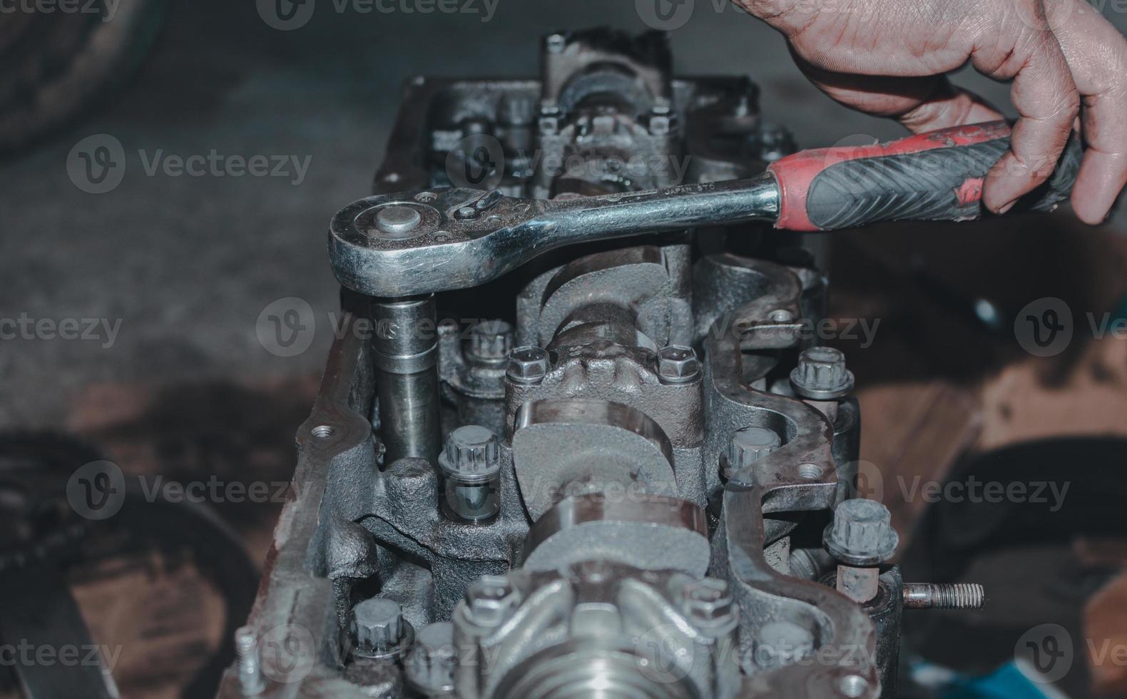 The mechanic is checking the engine. photo