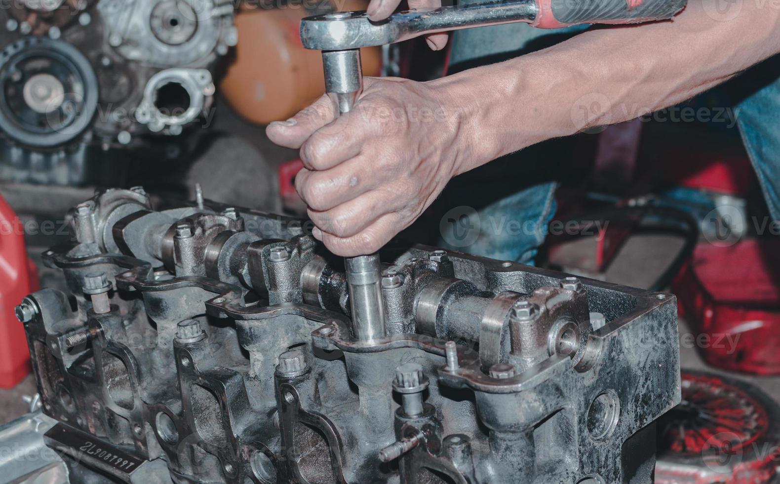 The mechanic is checking the engine. photo