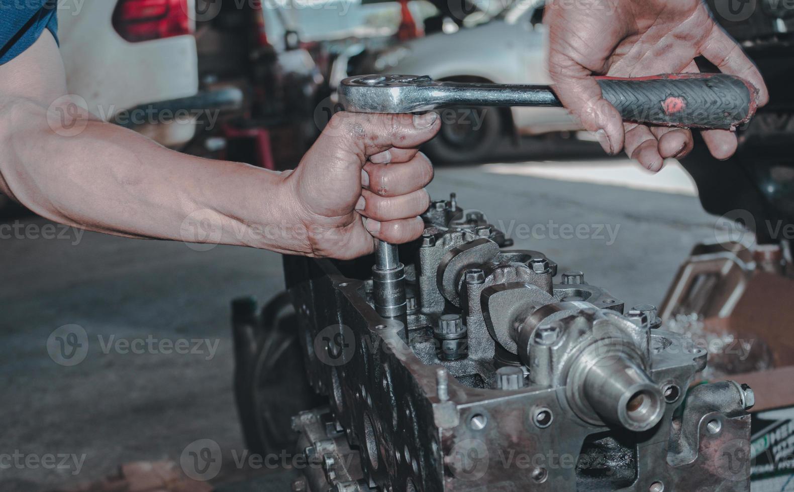 The mechanic is checking the engine. photo