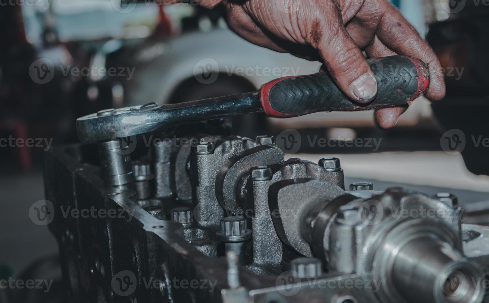 The mechanic is checking the engine. photo