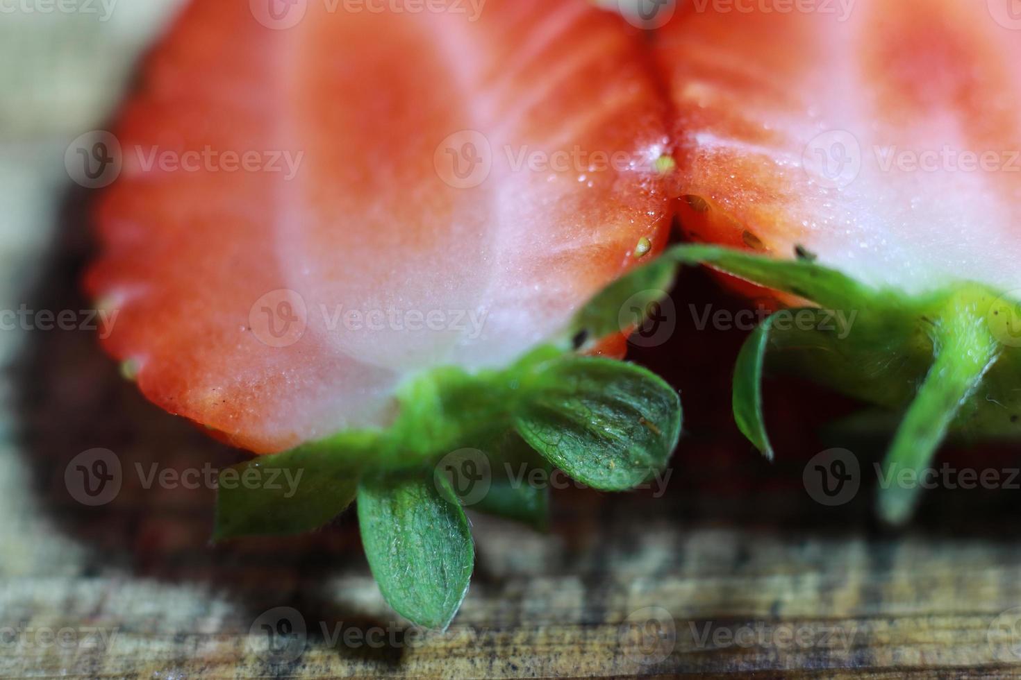 Fresh strawberry close up with slices photo