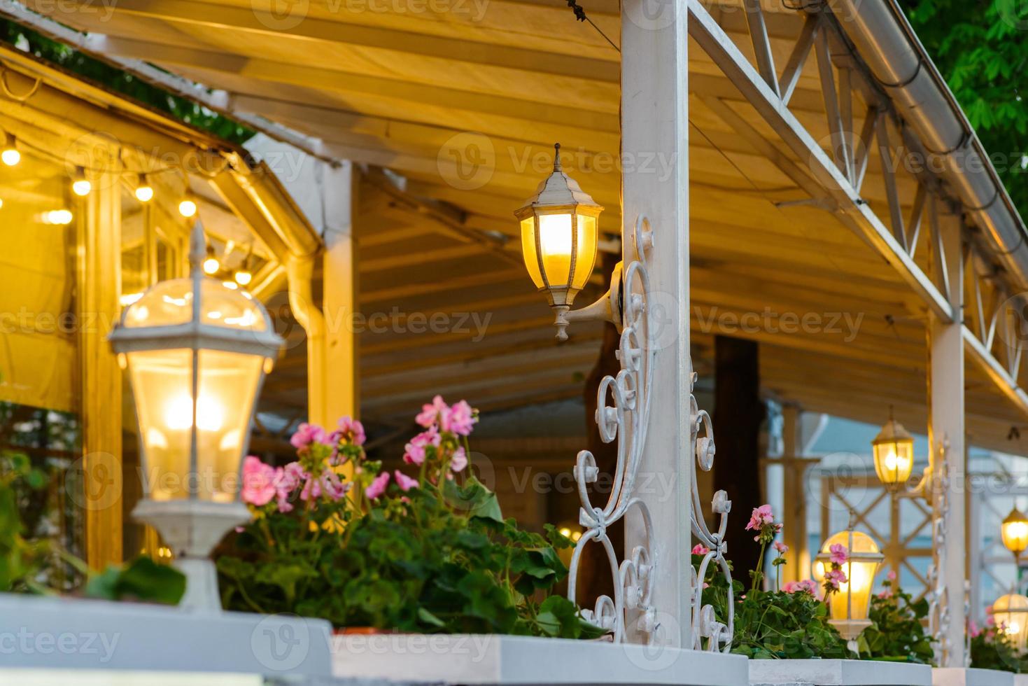 summer terrace with decorative lamps photo
