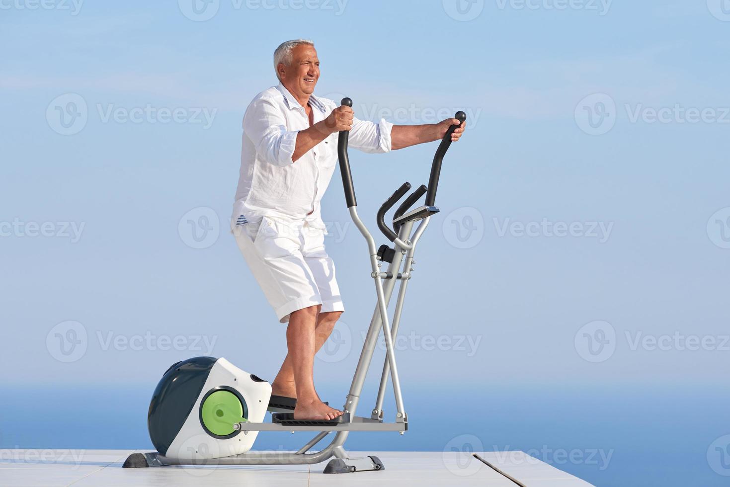 healthy senior man working out photo