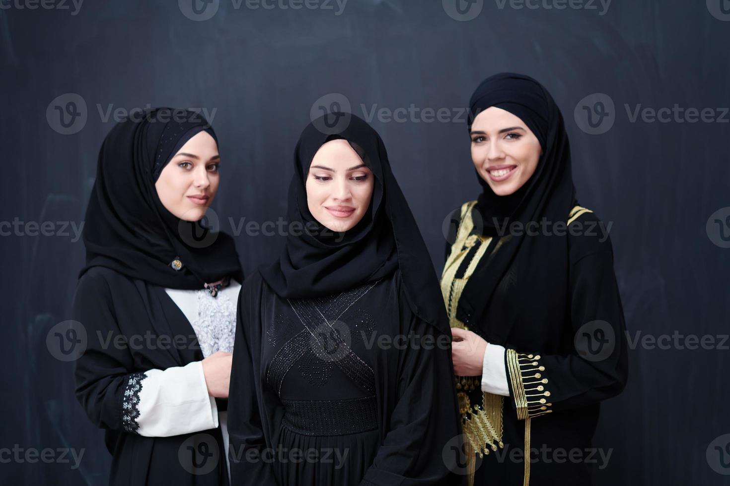 portrait of beautiful muslim women in fashionable dress photo