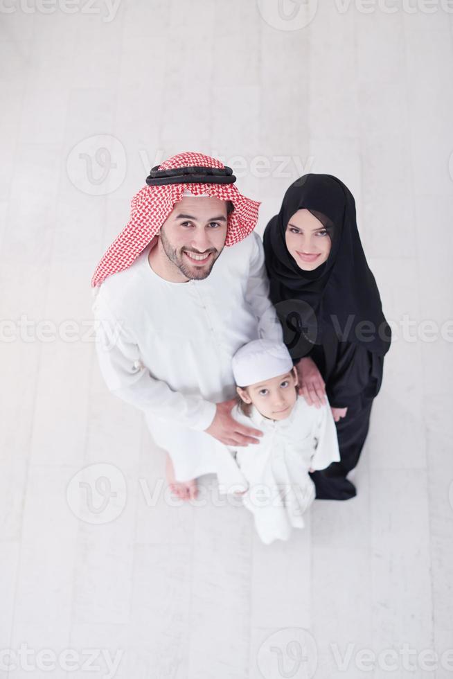 portrait of young happy arabian muslim family top view photo