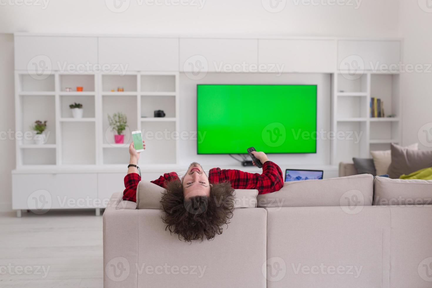 young man in bathrobe enjoying free time photo