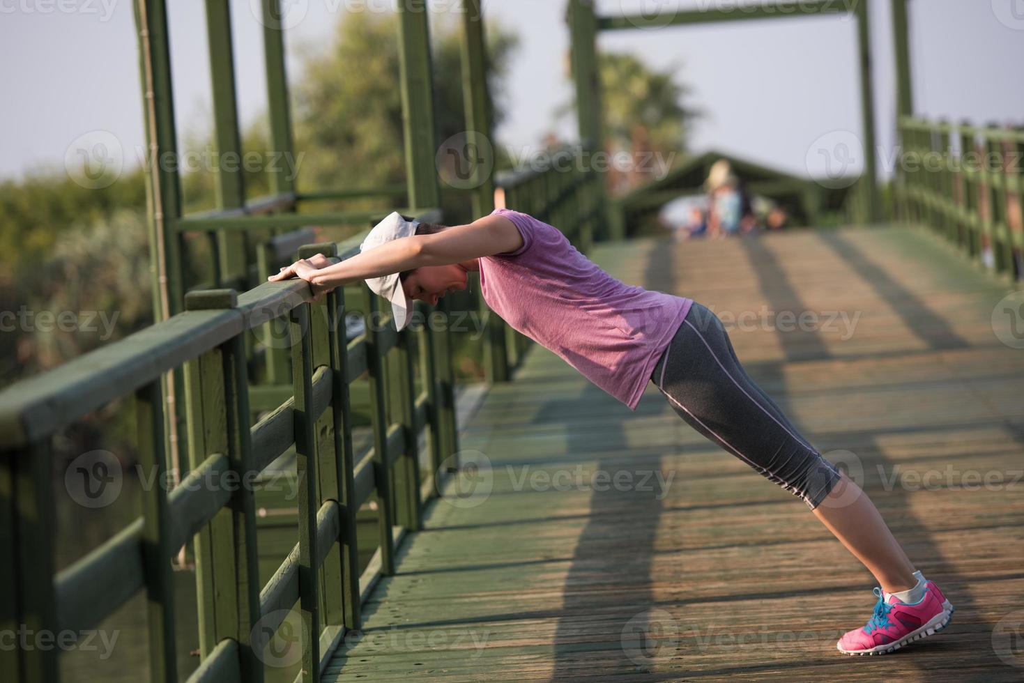 woman  stretching before morning jogging photo