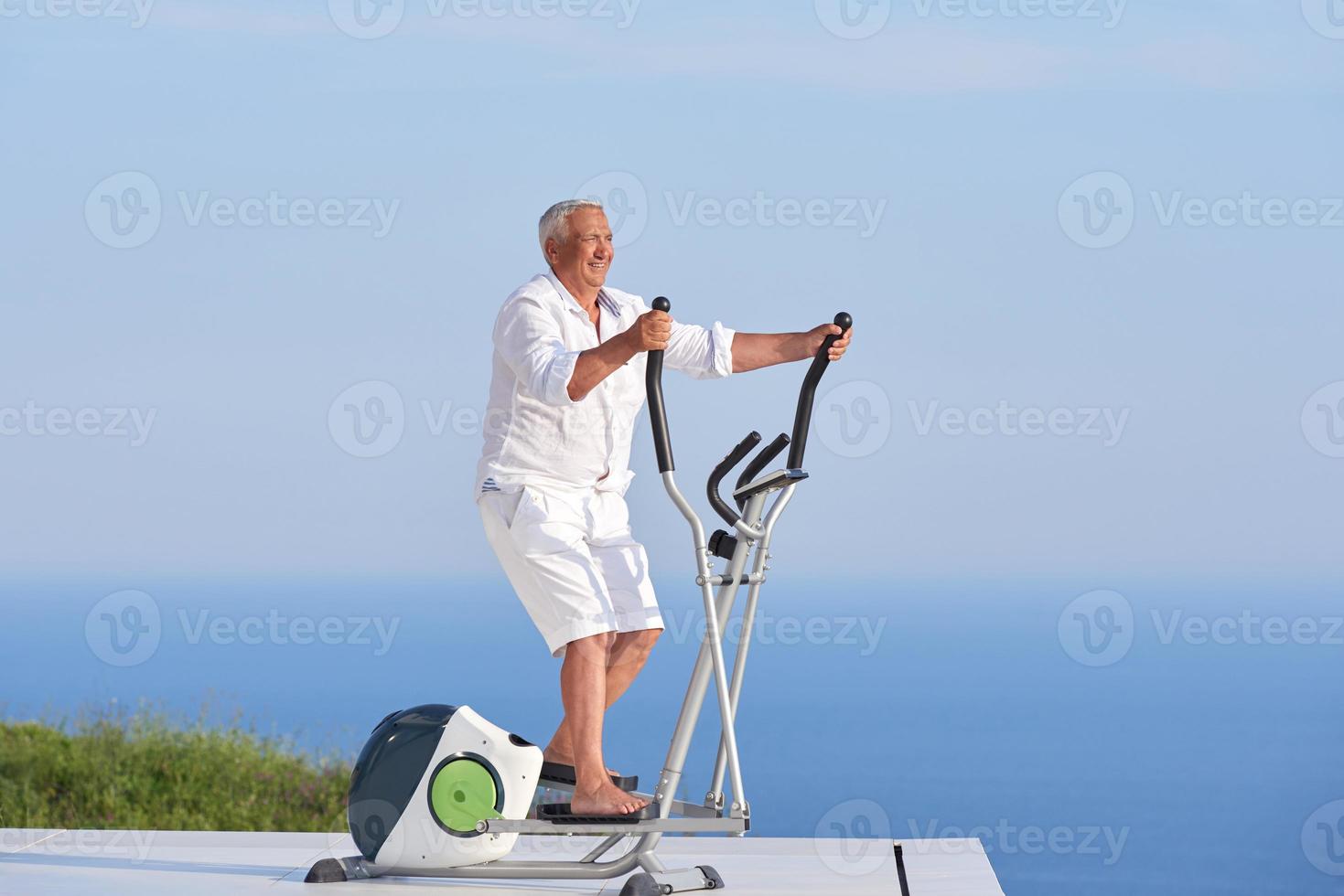 healthy senior man working out photo