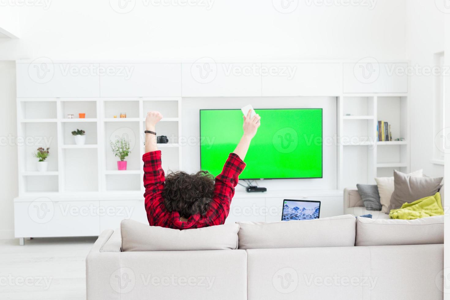 young man in bathrobe enjoying free time photo