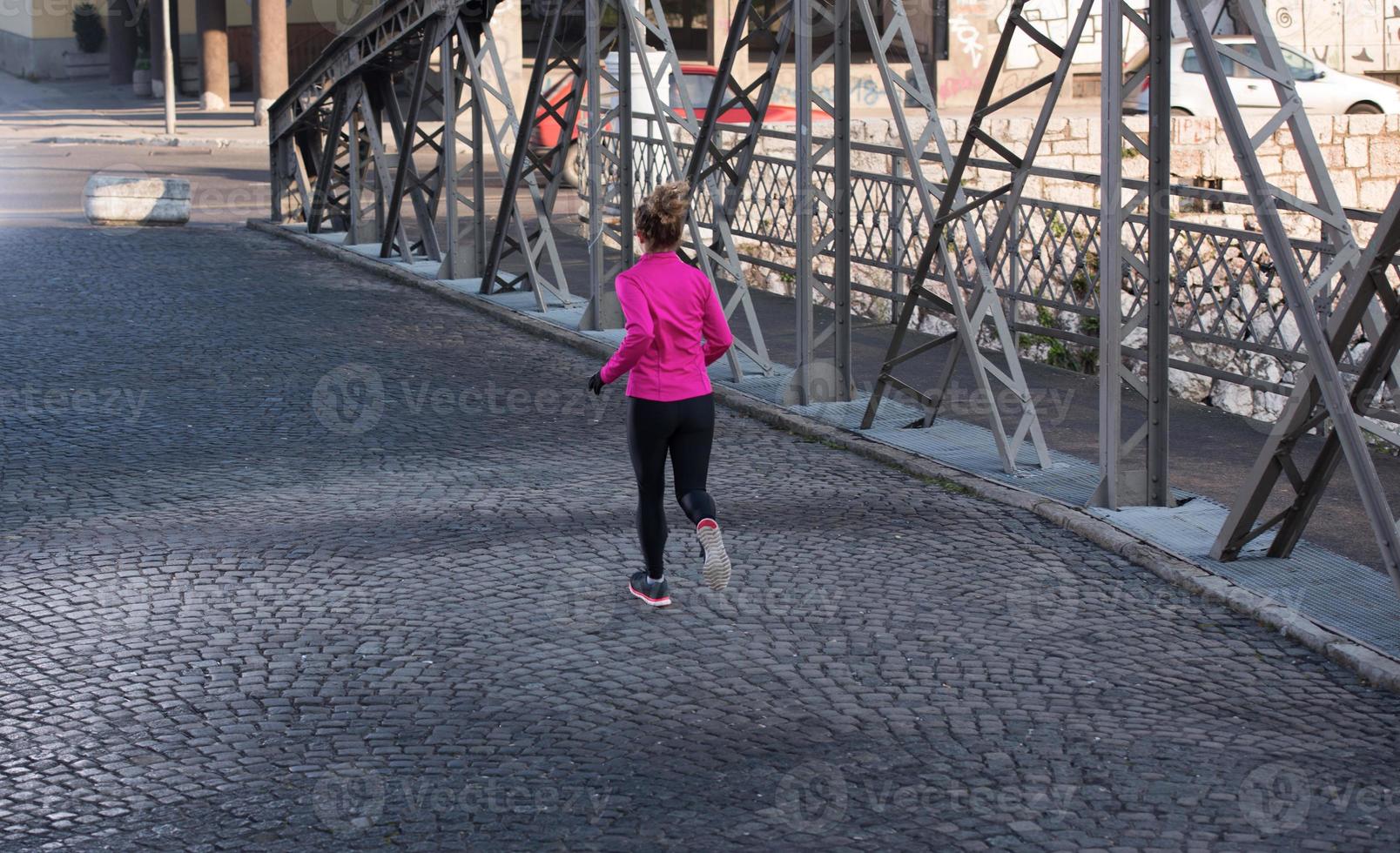 sporty woman jogging on morning photo