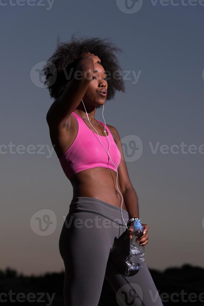 african american woman jogging in nature photo