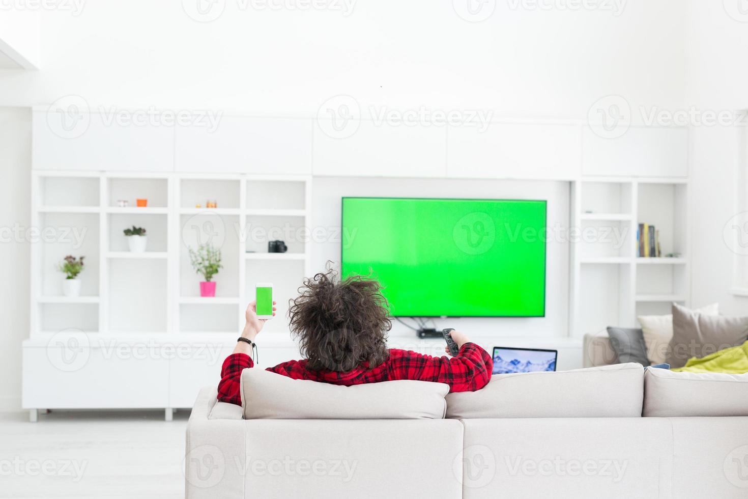 young man in bathrobe enjoying free time photo