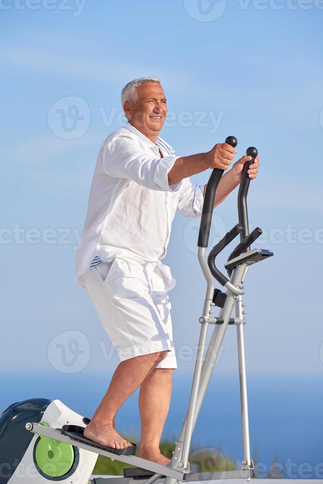 healthy senior man working out photo