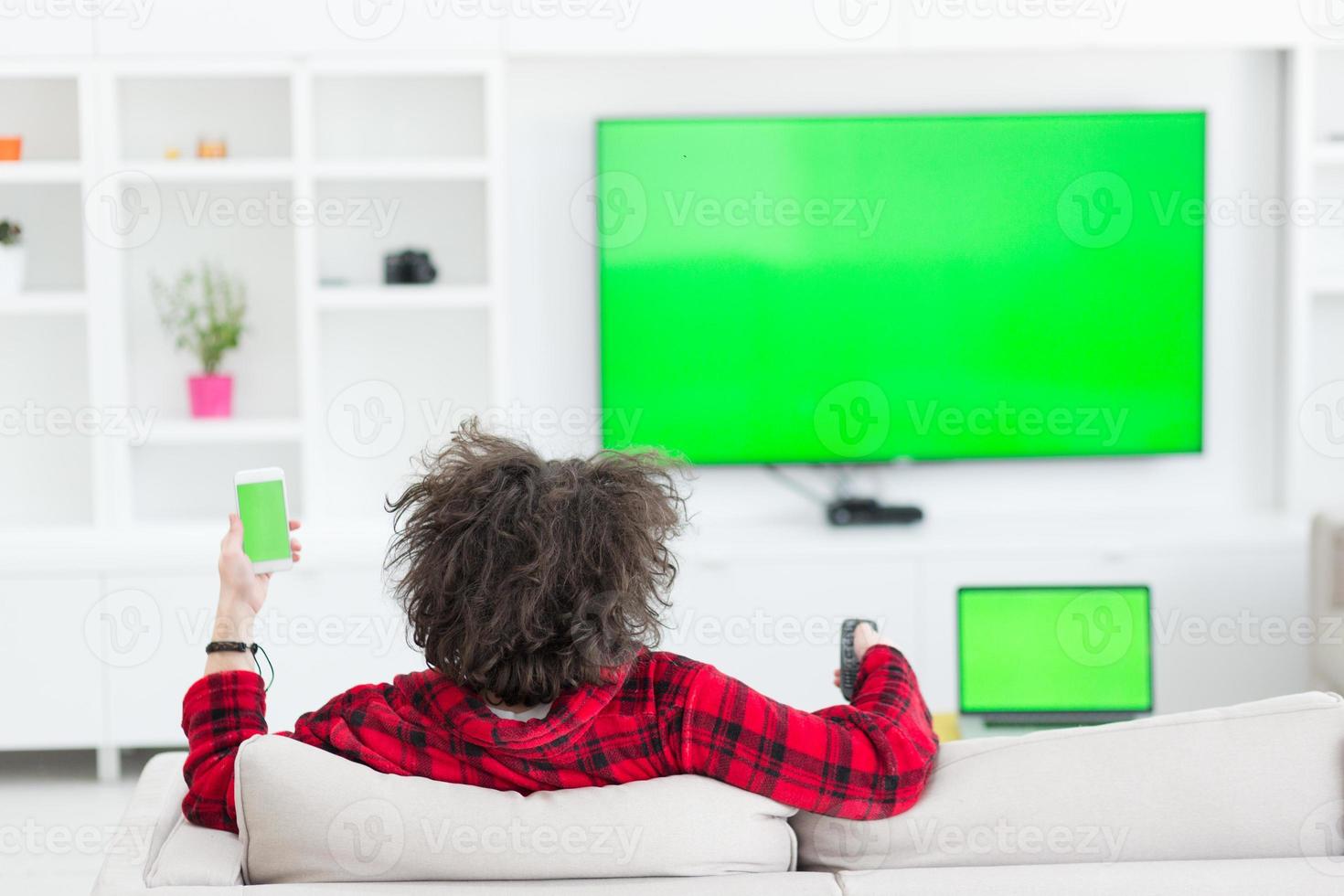 young man in bathrobe enjoying free time photo